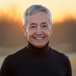 Smiling person outdoors during sunset.