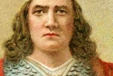 Medieval king wearing a crown and armor.