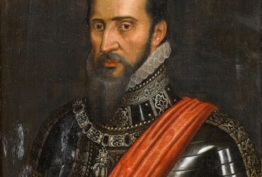 Man in ornate armor with red sash.